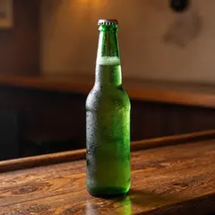 Z-Image Turbo — A green glass bottle of craft beer with condensati
